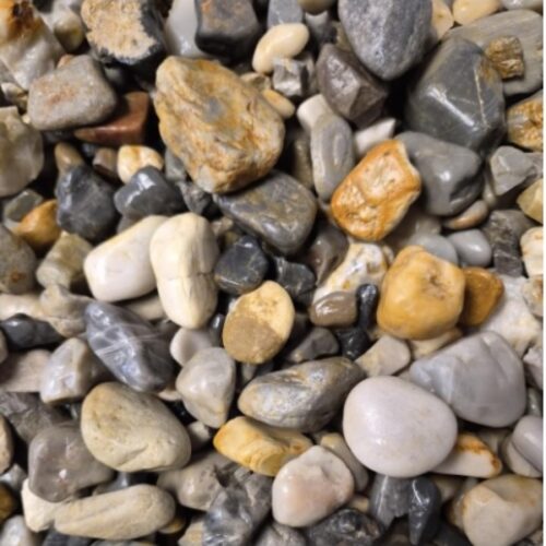 Smooth Shadow River Rock gravel in shades of gray, tan, cream, and gold for decorative landscaping.